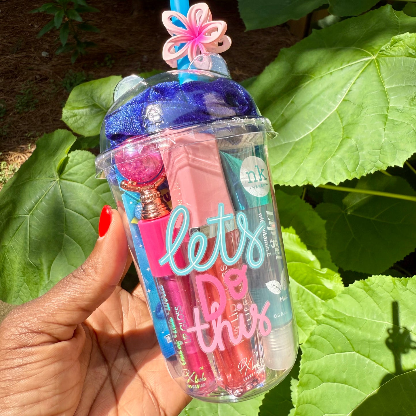 inspirational cup with cosmetic items