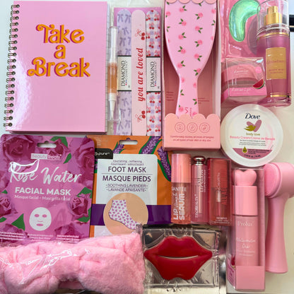Collection of beauty and self-care products including a notebook, facial mask, and hairbrush. 